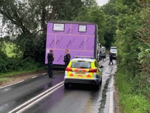 Illustrating Blocked: Main B1029 Brightlingsea Road at a standstill after wide load hits tree on Info Staging