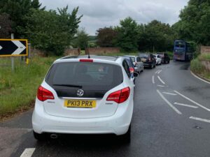 Illustrating Blocked: Main B1029 Brightlingsea Road at a standstill after wide load hits tree on Info Staging