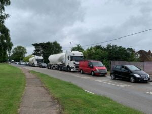 Illustrating Blocked: Main B1029 Brightlingsea Road at a standstill after wide load hits tree on Info Staging