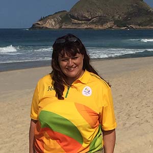 a woman standing on a beach