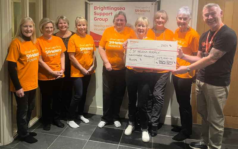 Illustrating Town's St Helena Hospice fundraisers hand over £23,000 cheque on Brightlingsea Info